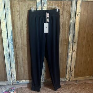 Black jogger style with two handy zip pockets. New never worn.